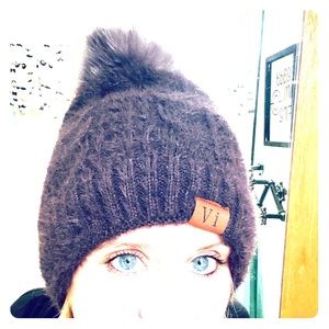 Winter hat with detachable puff ball
